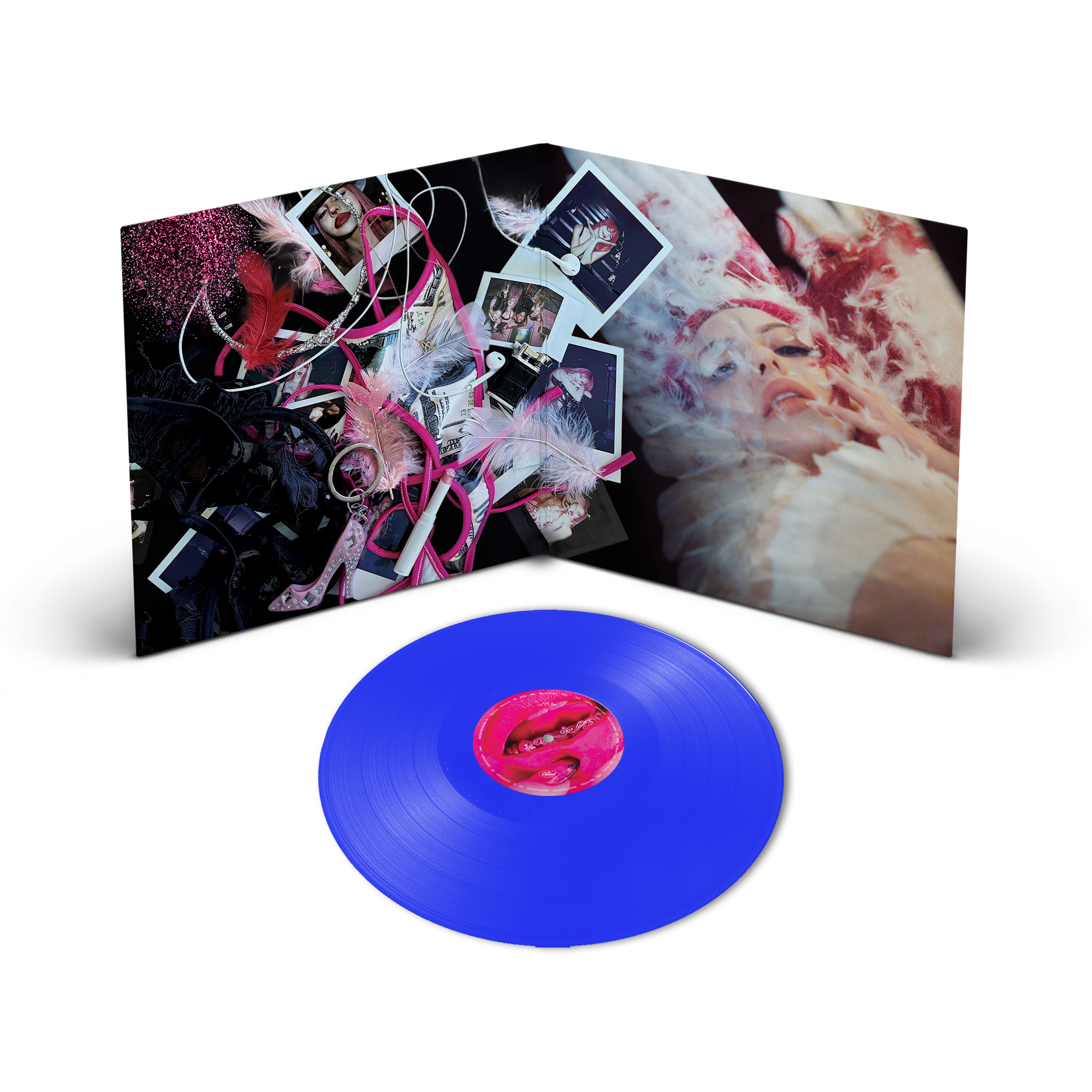 A vinyl record shown in front of its open gatefold cover. The record is a vivid translucent blue with a hot pink center label.