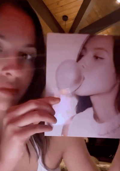Animated Image of Olivia Rodrigo putting her 7" vinyl on a record player