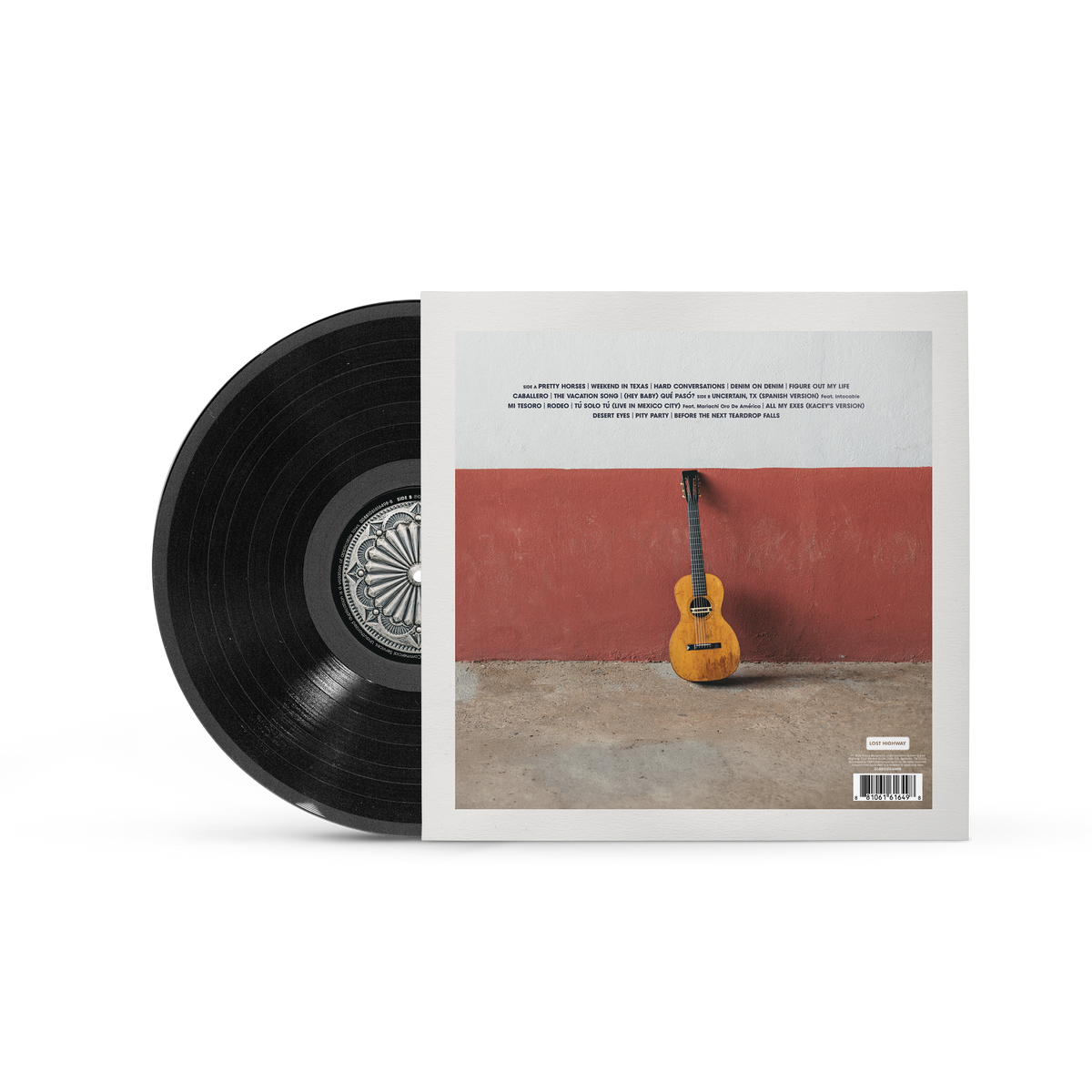 A vinyl record partially pulled from its sleeve, showing the black record and the back cover artwork with a red wall, concrete floor, and a yellow acoustic guitar.